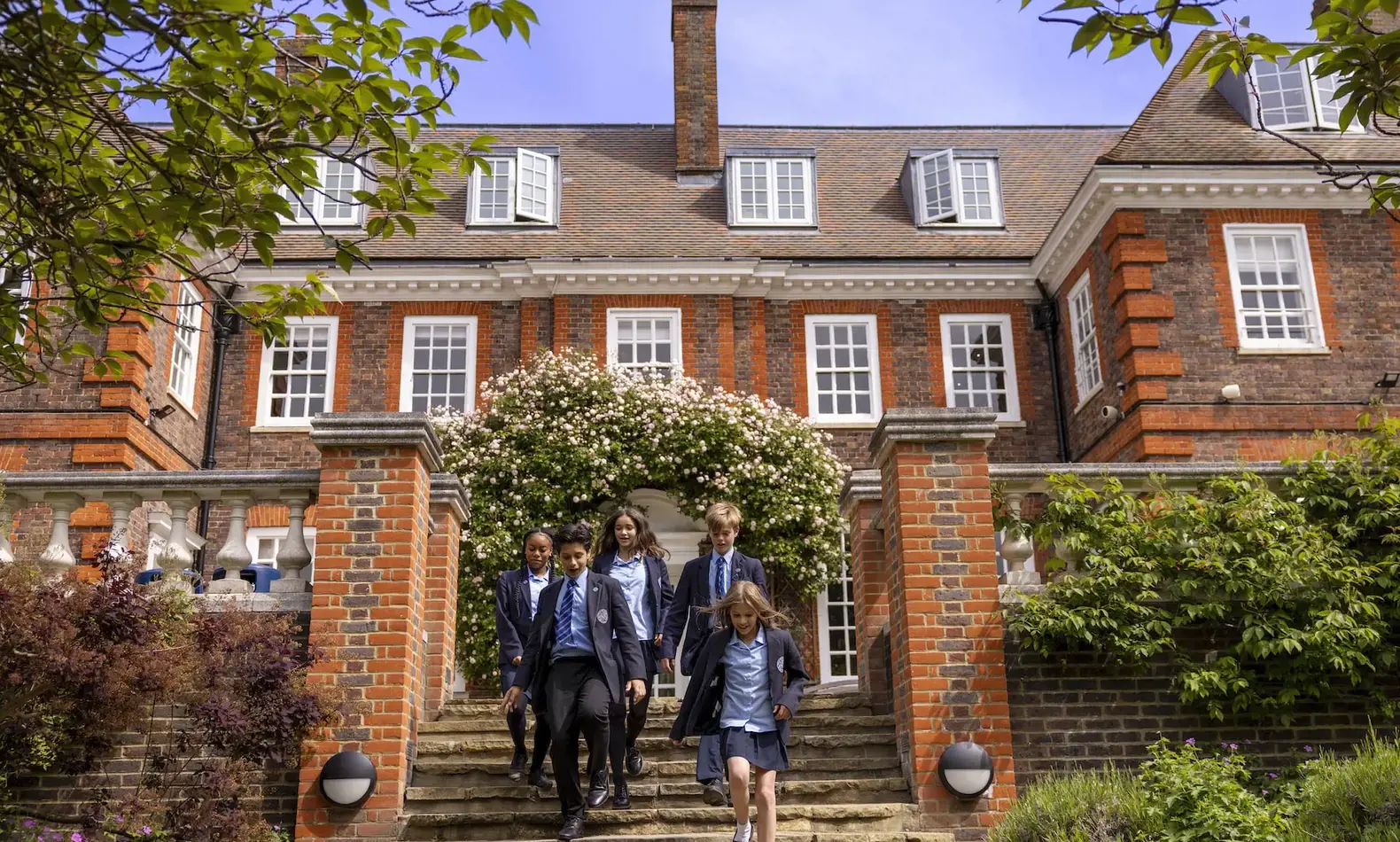 Senior pupils running the stairs in the campus of Ibstock Place School, a private school near Richmond.