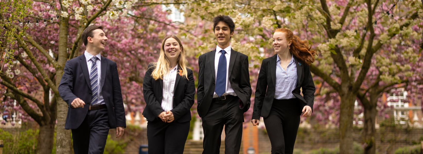 Sixth form pupils walking through the beautiful campus of  Ibstock Place School, a private school near Richmond.