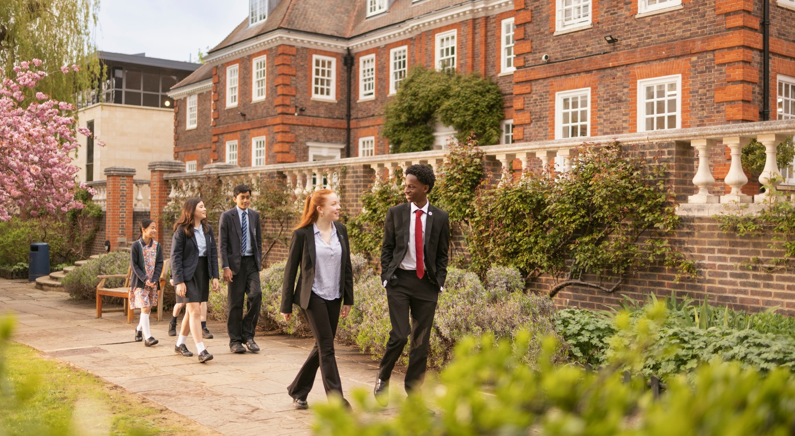 Senior pupils walking in the campus of Ibstock Place School, a private school near Richmond.