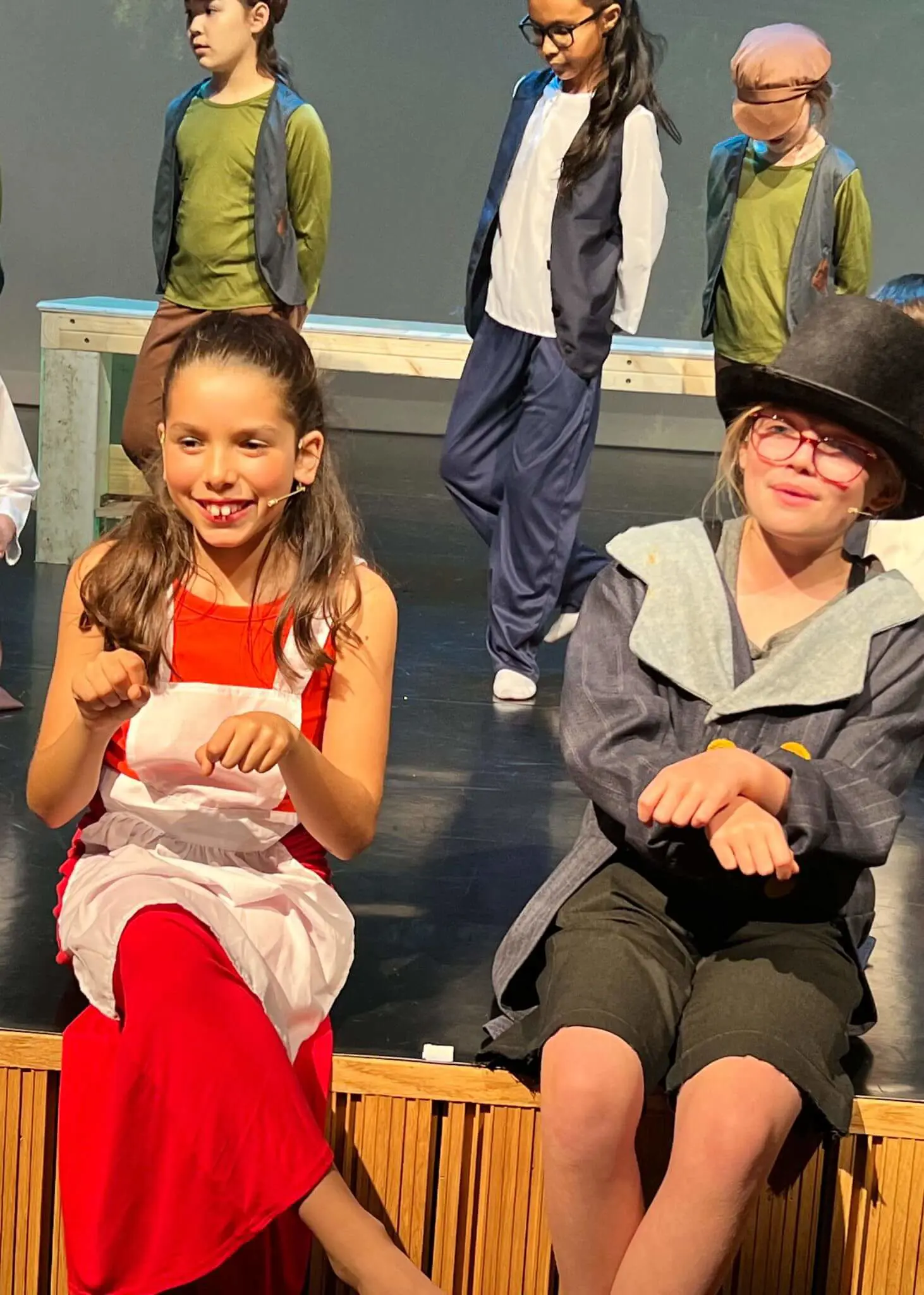 Prep pupils performing a play at Ibstock Place School, a private school near Richmond, Barnes, Putney, Kingston, and Wandsworth on an overseas trip. 