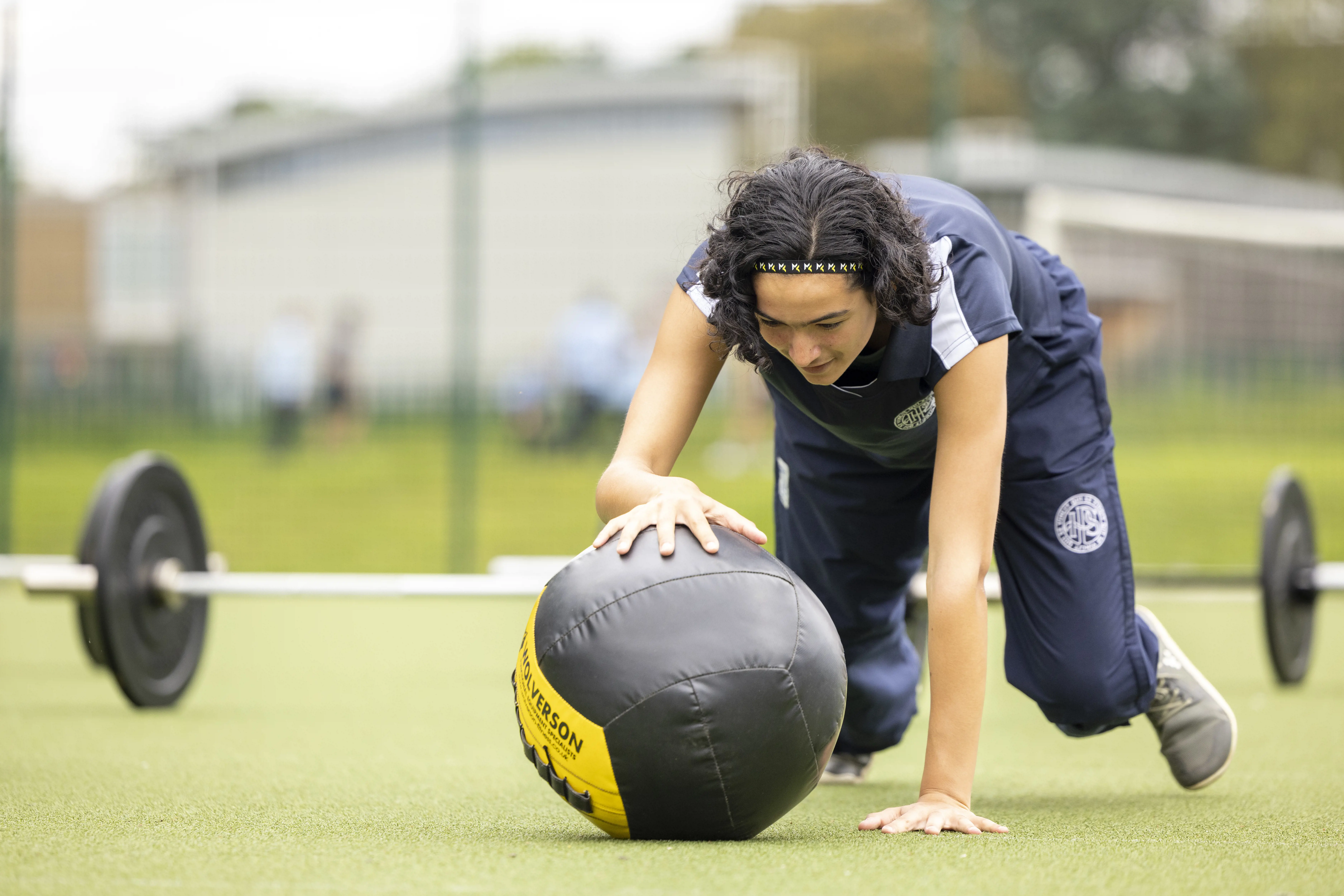 Sixth form girls doing a warm up at Ibstock Place School, a private school near Richmond, Barnes, Putney, Kingston, and Wandsworth