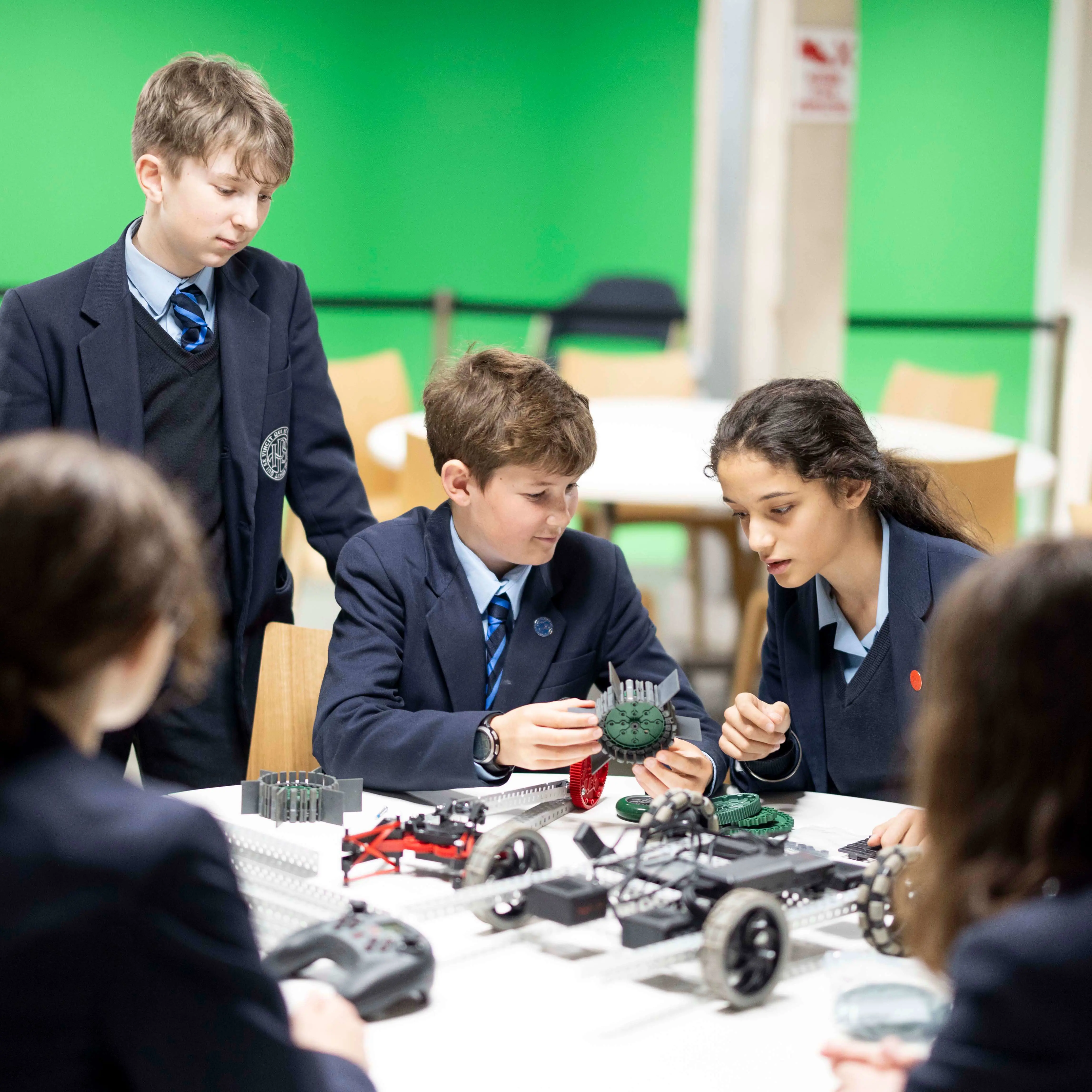 Pupils at  Ibstock Place School, Private Prep School Near Richmond, Barnes, Putney, Kingston, & Wandsworth, building robotic car.