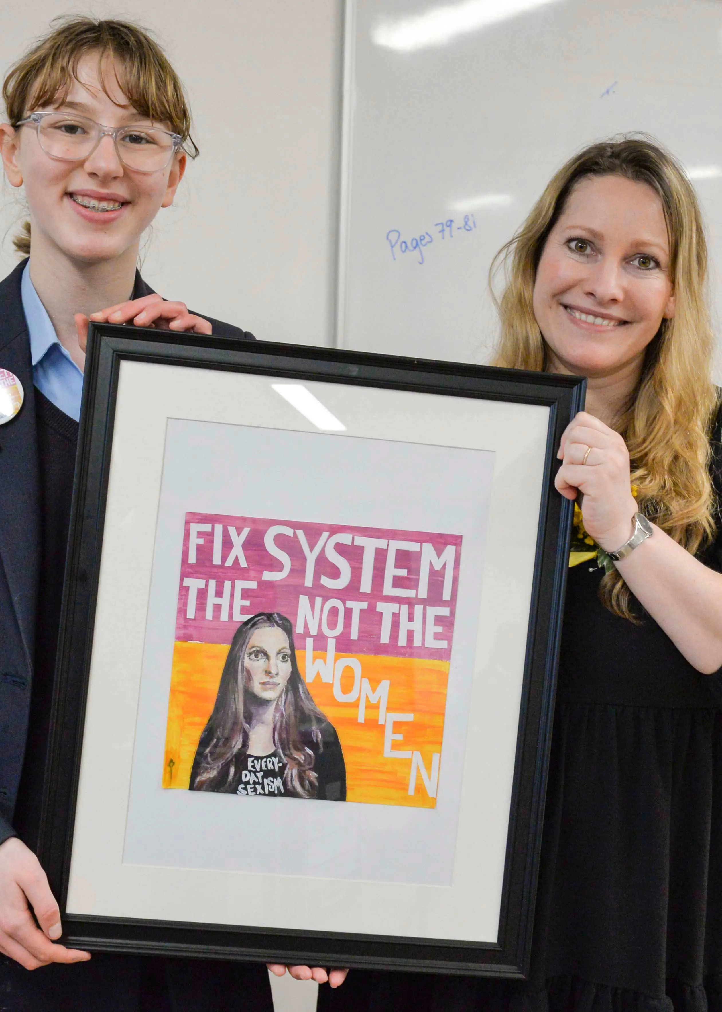 Pupils gifting a Laura Bates a portrait she that she hand painted at Ibstock School School, Near Richmond, Barnes and Putney