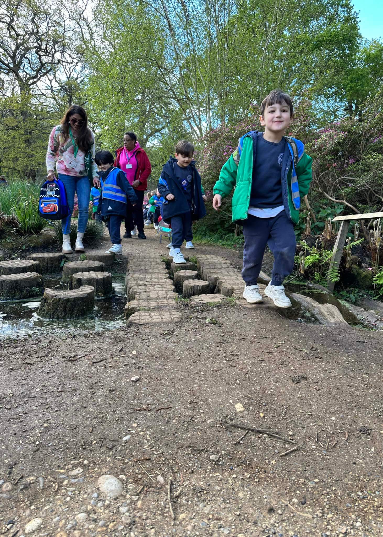 Kindergarten pupils on stepping stones | Ibstock Place School, a private school near Richmond, Barnes, Putney, Kingston, and Wandsworth.