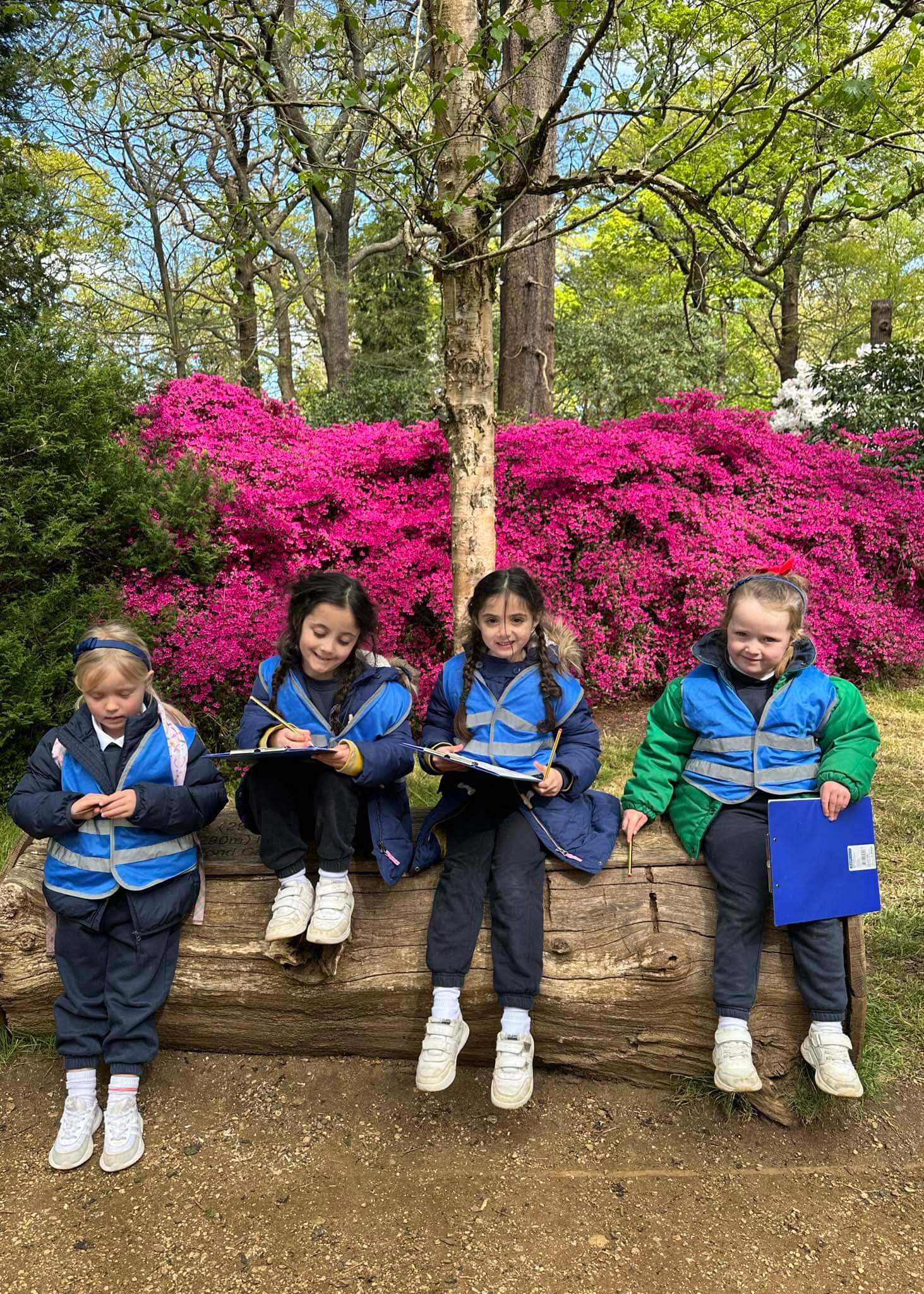 Kindergarten pupils taking notes of their surroundings | Ibstock Place School, a private school near Richmond, Barnes, Putney, Kingston, and Wandsworth.