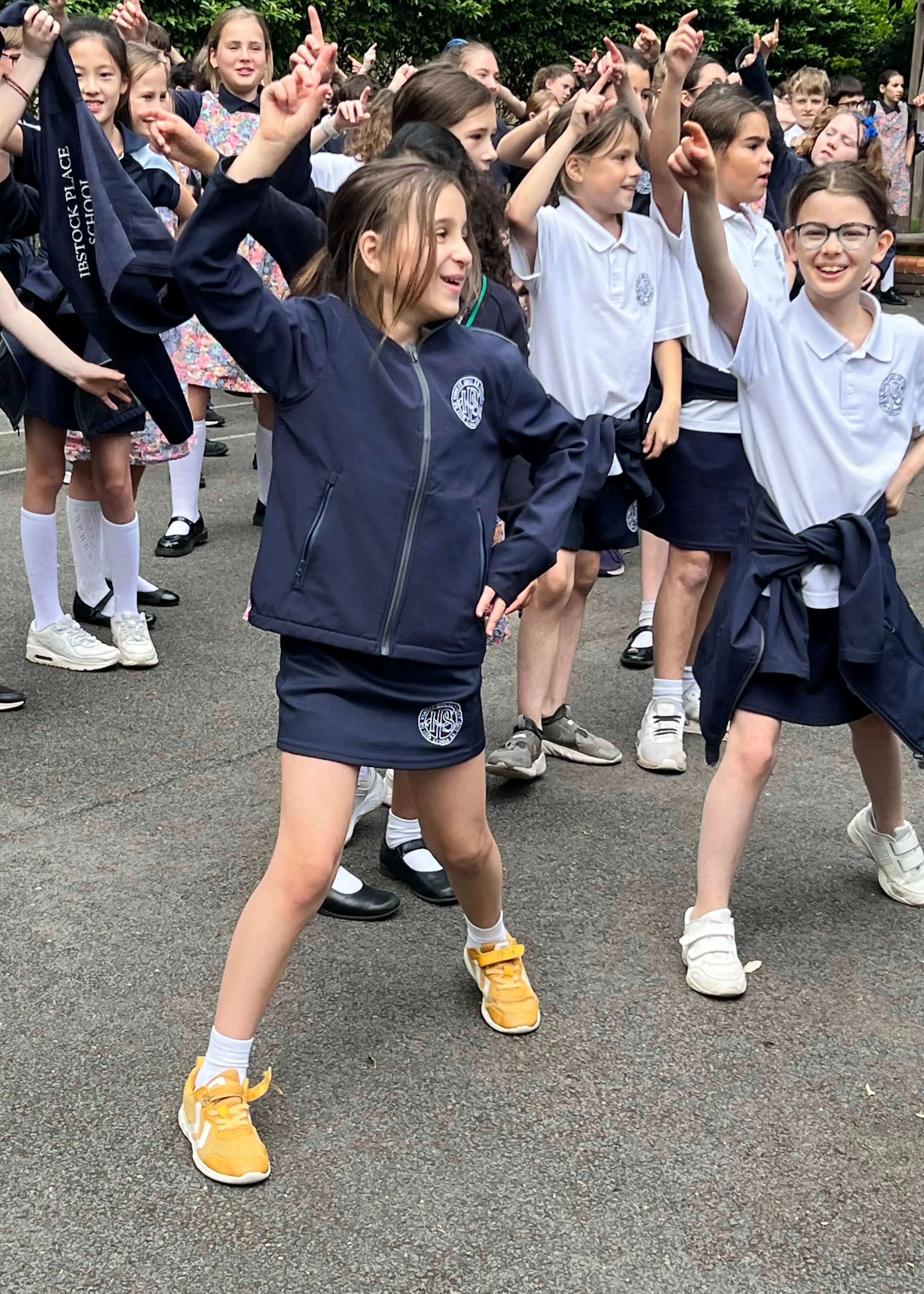 Prep pupils dancing on YMCA for Mental Health Awareness week at Ibstock Place School, a private school near Richmond, Barnes, Putney, Kingston, and Wandsworth on an overseas trip. 