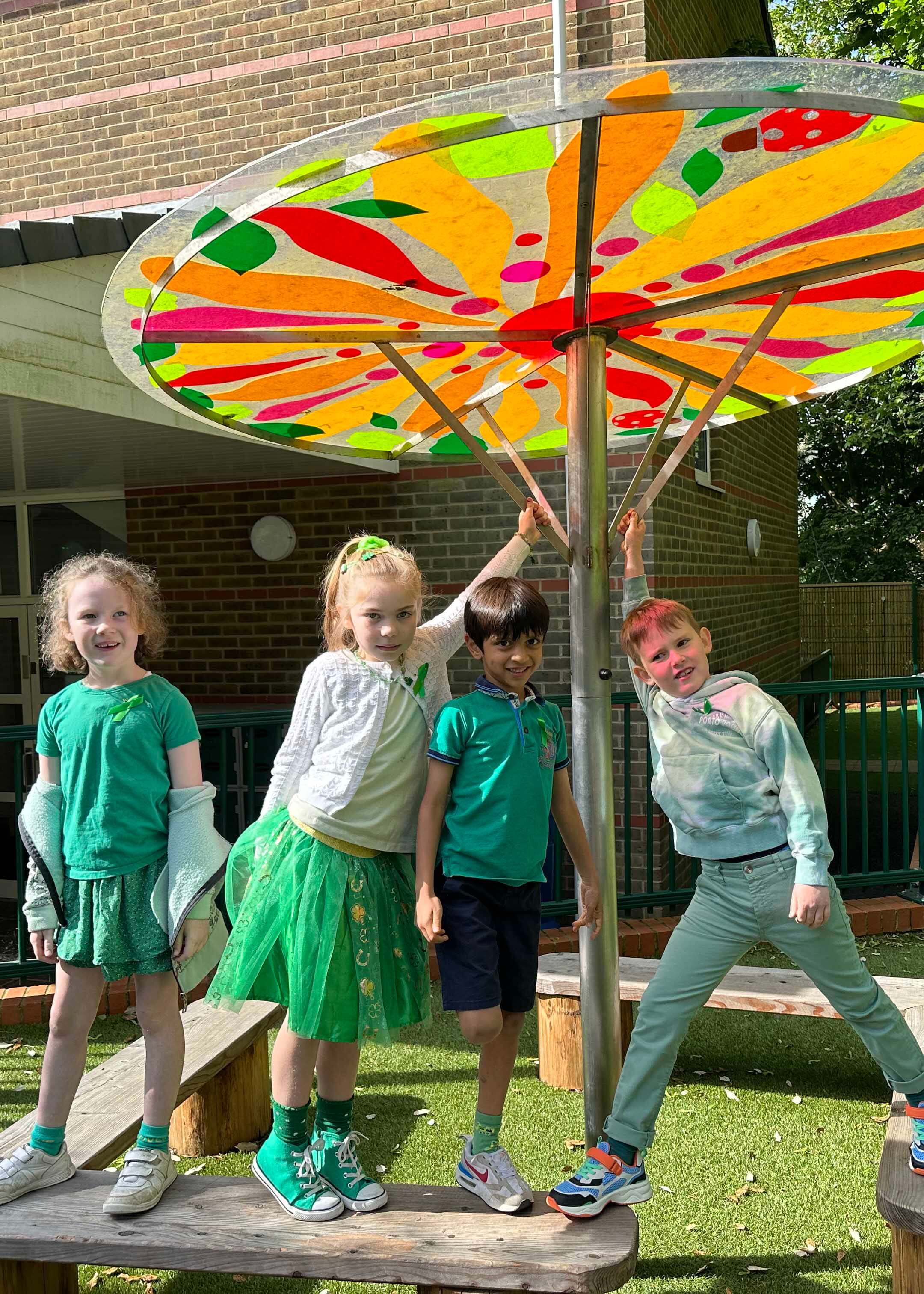 Prep pupils wearing green for Mental Health Awareness week at Ibstock Place School, a private school near Richmond, Barnes, Putney, Kingston, and Wandsworth on an overseas trip. 