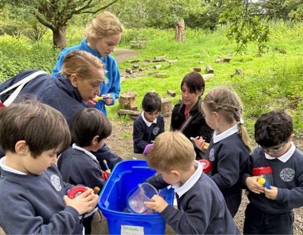 Pre-prep pupils playing in the forest school of Ibstock Place School, a private school near Richmond