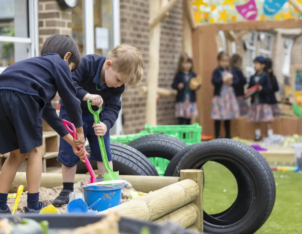 prep pupils playing in the playground of Ibstock Place School, a private school near Richmond.
