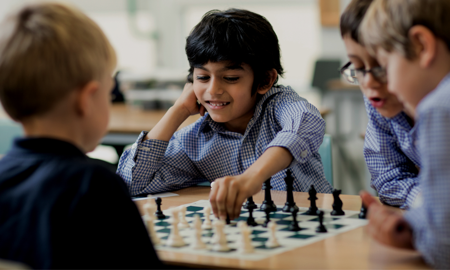 prep pupils playing chess at Ibstock Place School, a private school near Richmond.