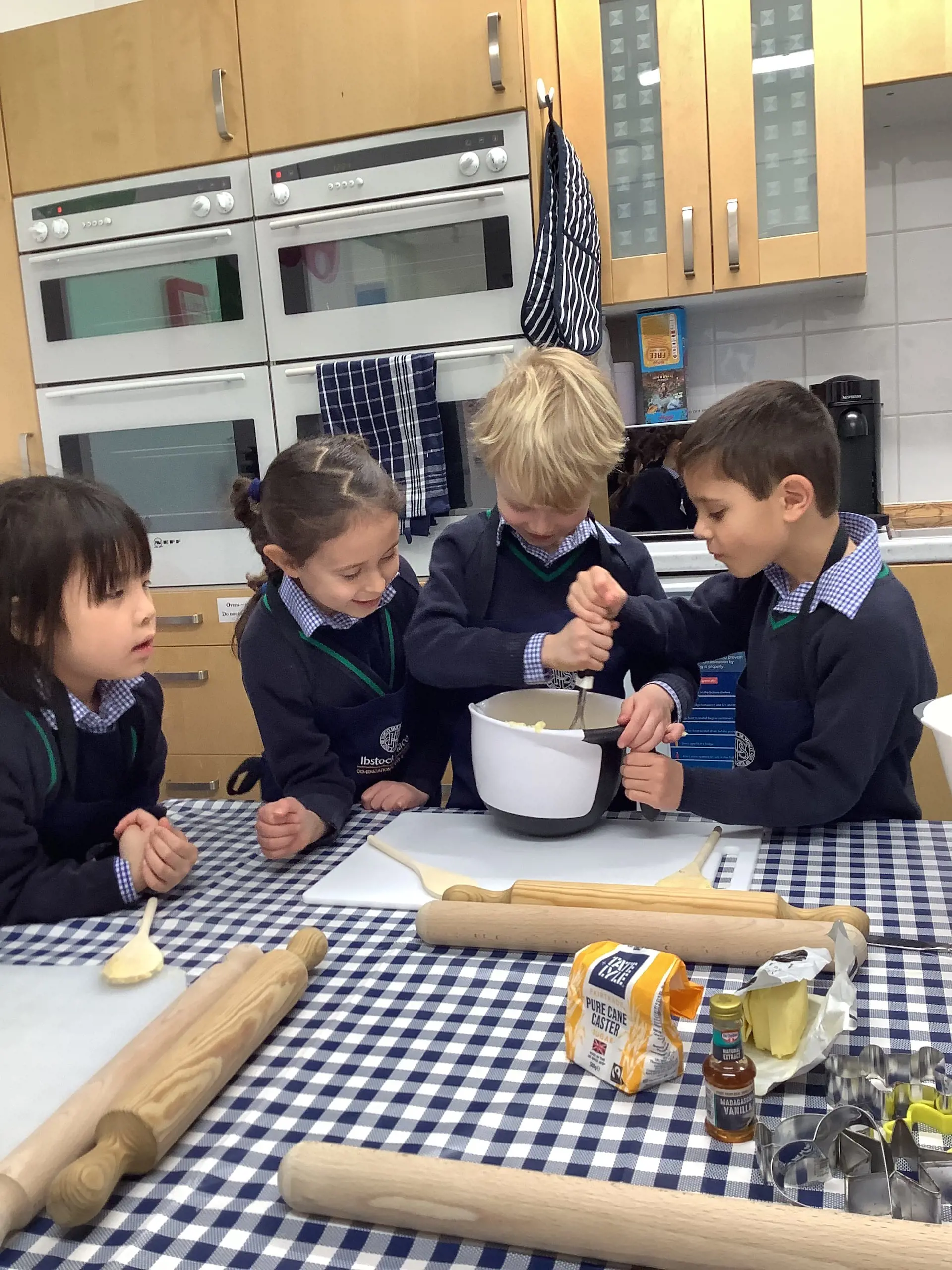 prep pupils cooking at Ibstock Place School, a private school near Richmond.