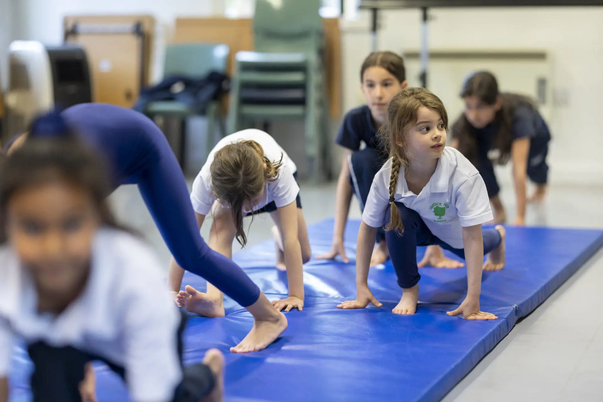prep pupils learning yoga at Ibstock Place School, a private school near Richmond.