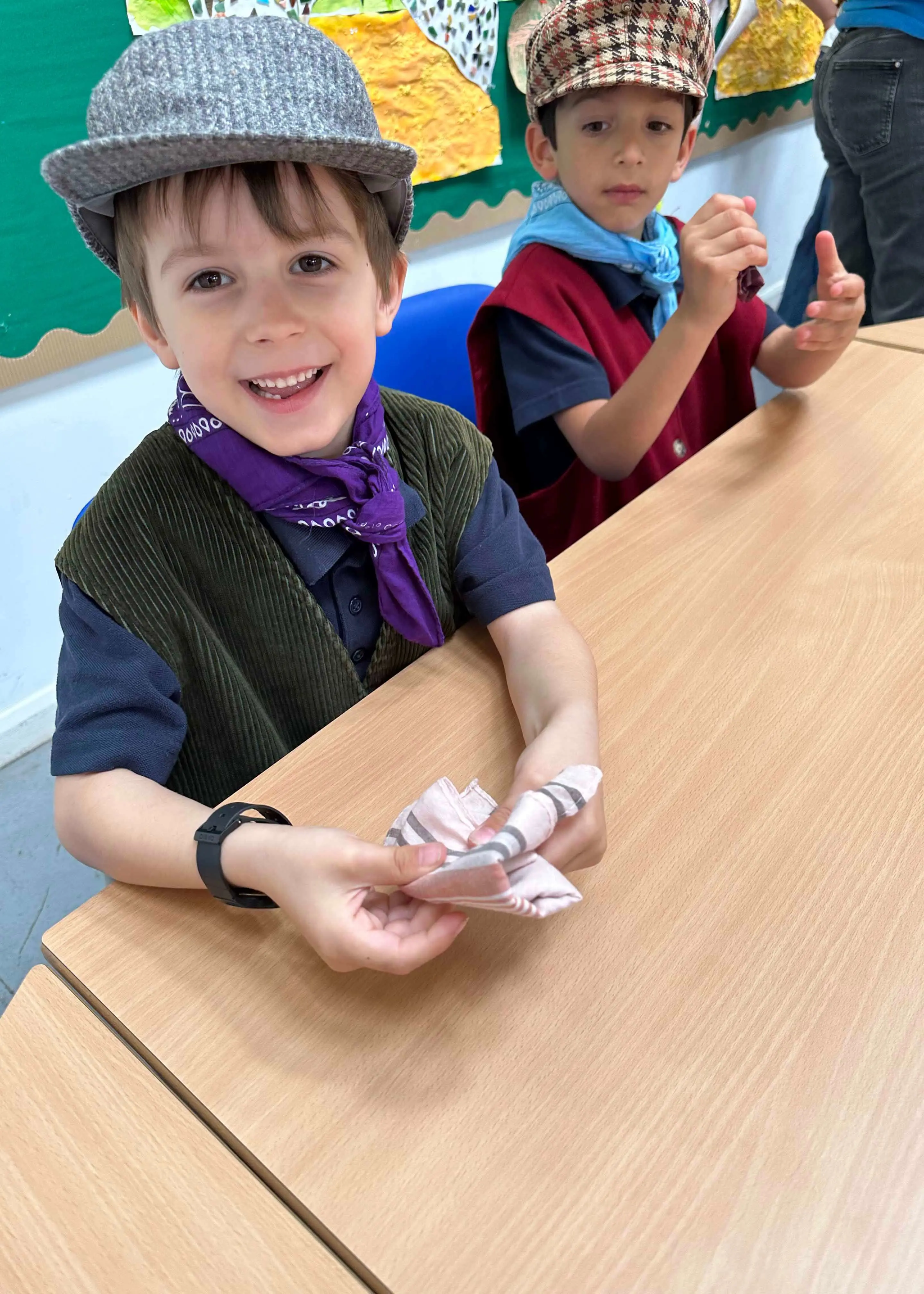 Prep 1 pupil holding an old victorian times coin | Ibstock Place School, a private school near Richmond, Barnes, Putney, Kingston, and Wandsworth on an overseas trip. 