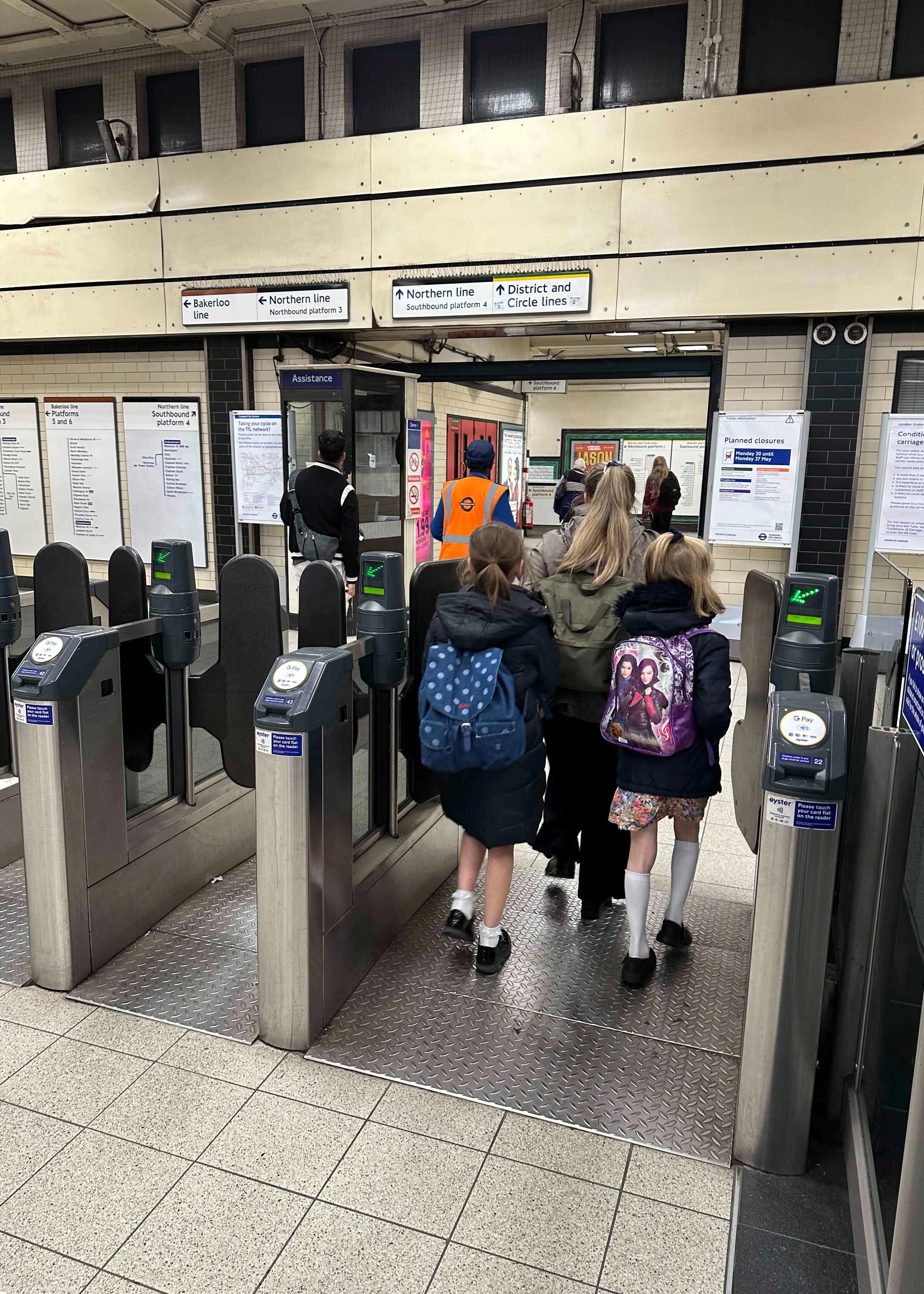 Prep 4 pupils going through the ticket holder at a tube station | Ibstock Place School, a private school near Richmond, Barnes, Putney, Kingston, and Wandsworth on an overseas trip. 