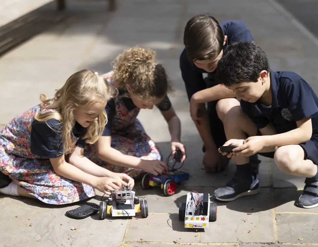 Prep pupils playing with toy cars at Ibstock Place School, a private school near Richmond
