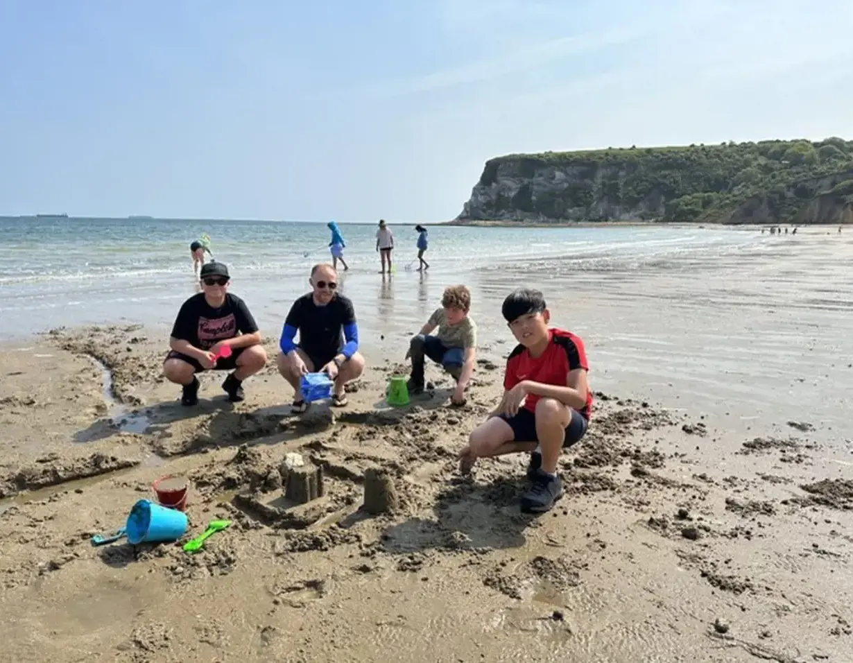Prep pupils at the beach making sand castles.