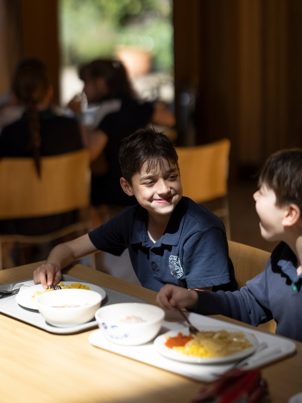 Prep pupil having lunch at The Great Hall of Ibstock Place School