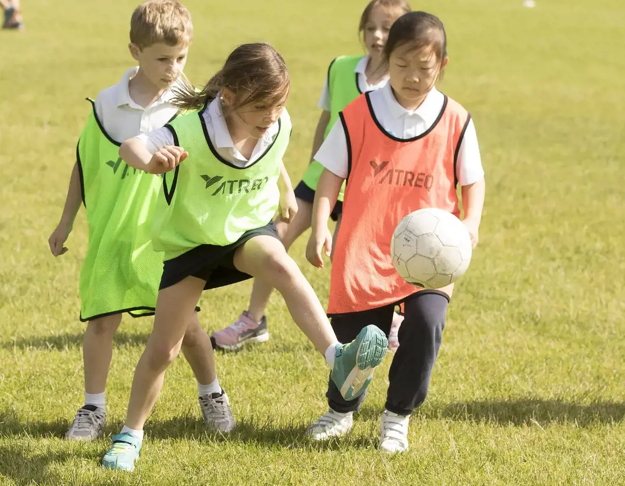 Prep pupils playing football at Ibstock Place School, a private school near Richmond.