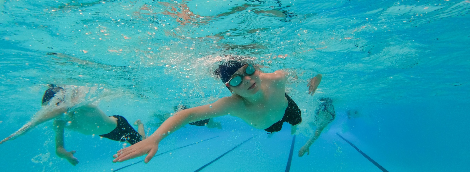 Prep pupil doing underwater swimming at Ibstock Place School, a private school near Richmond