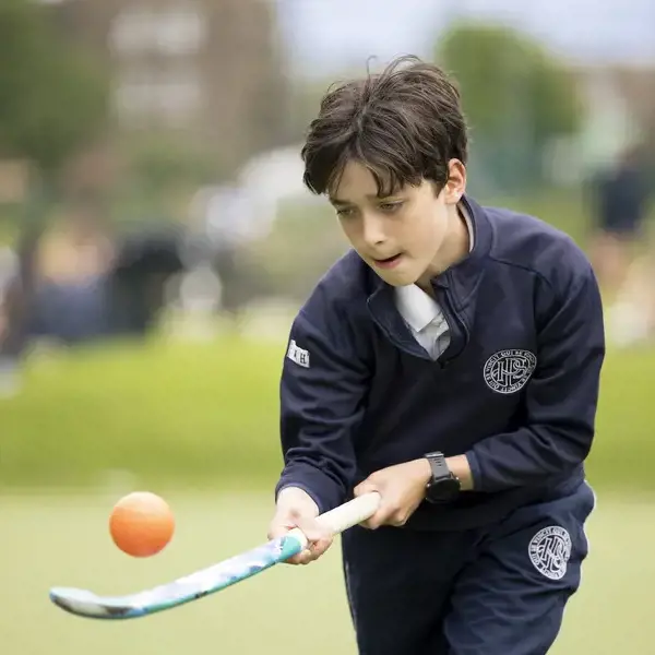 Prep pupils playing hockey at Ibstock Place School, a private school near Richmond.