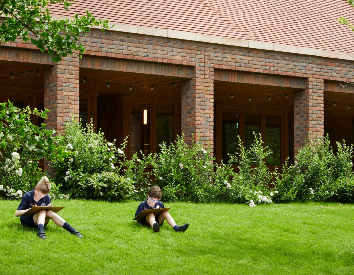 Prep pupils studying in the nature in the campus at Ibstock Place School, a private school near Richmond