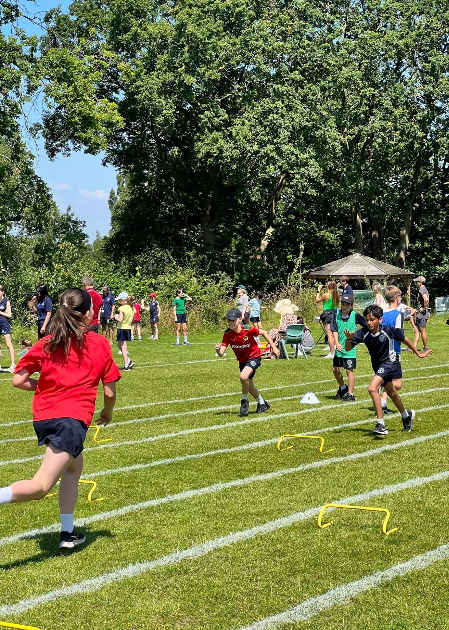 Prep pupil in a fun hurdle race | Ibstock Place School, Roehampton, Private School Near Richmond, Barnes, Putney, Kingston, & Wandsworth 