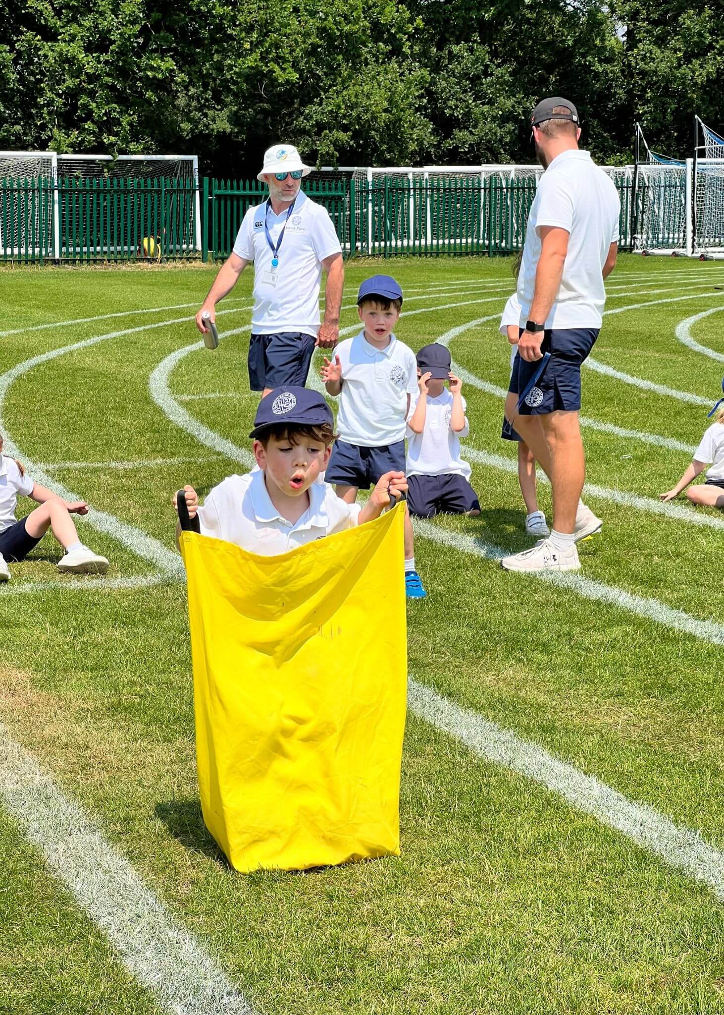 Prep pupils in a fun race at sports day| Ibstock Place School, Roehampton, Private School Near Richmond, Barnes, Putney, Kingston, & Wandsworth 