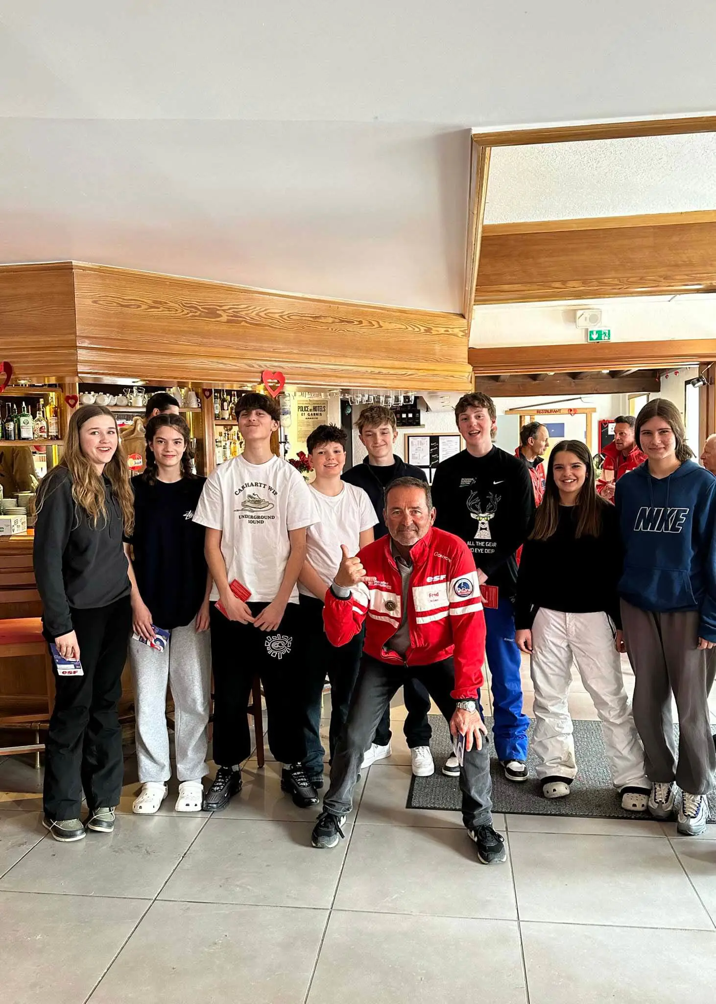 Senior pupils enjoying dinner during their ski trip to the Alps | Ibstock Place School, a private school near Richmond, Barnes, Putney, Kingston, and Wandsworth.