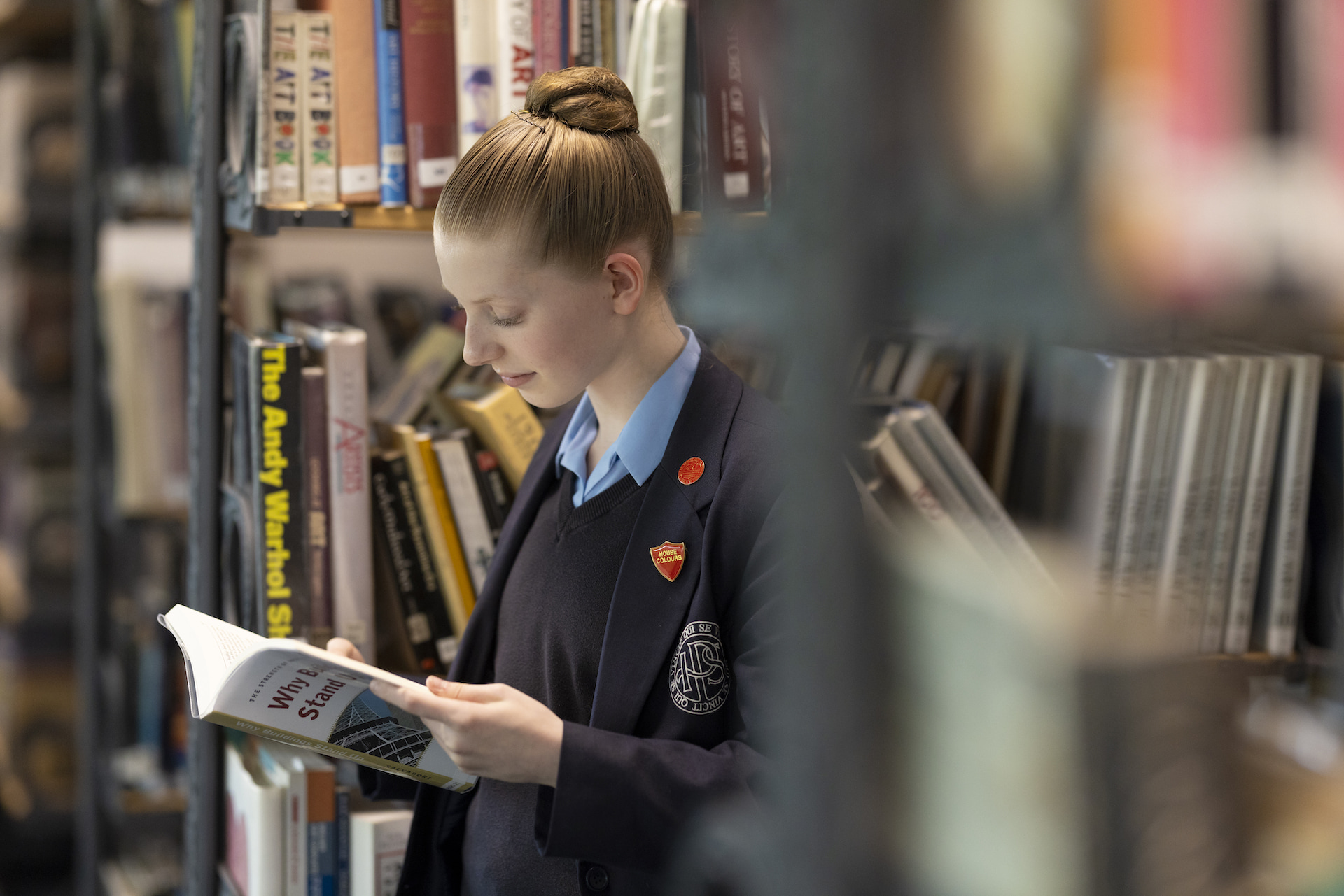 Senior pupils reading in the library at Ibstock Place School, a private school near Richmond, Barnes, Putney, Kingston, and Wandsworth