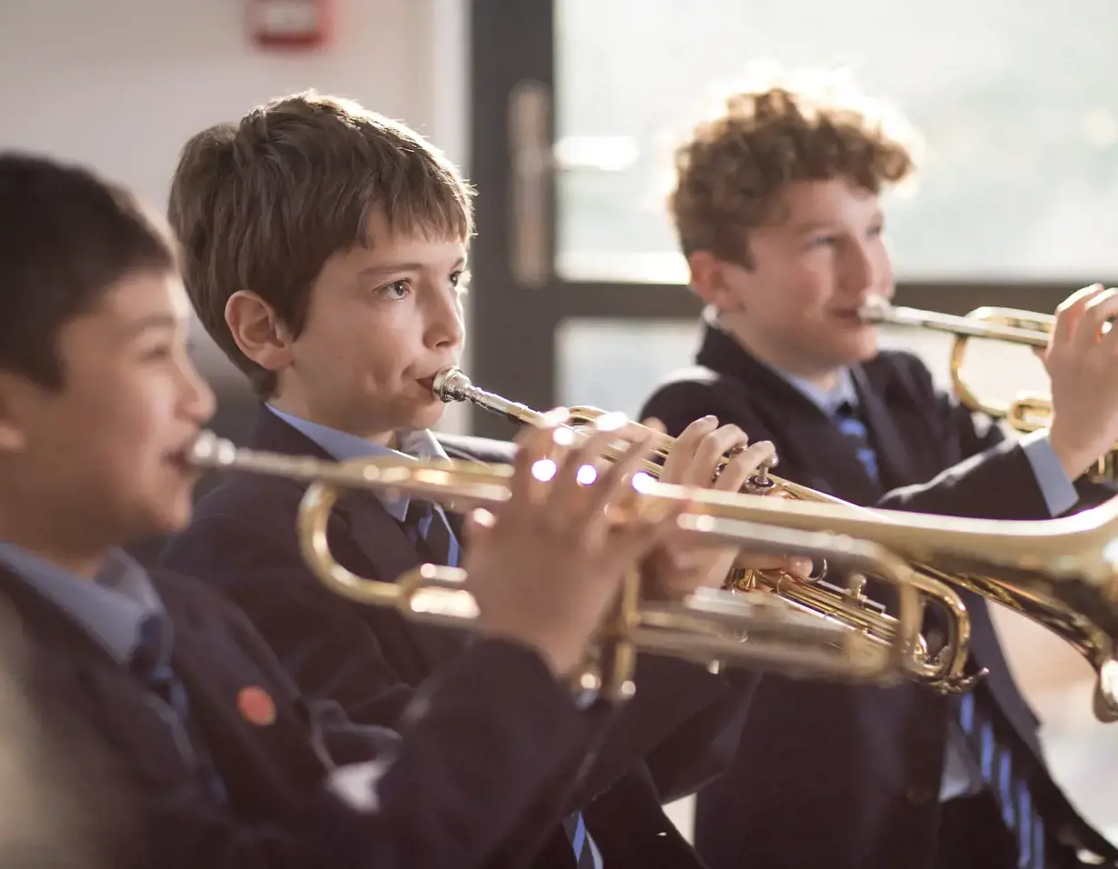 Senior pupil playing a musical instrument at Ibstock Place School, a private school near Richmond, Barnes, Putney, Kingston, and Wandsworth