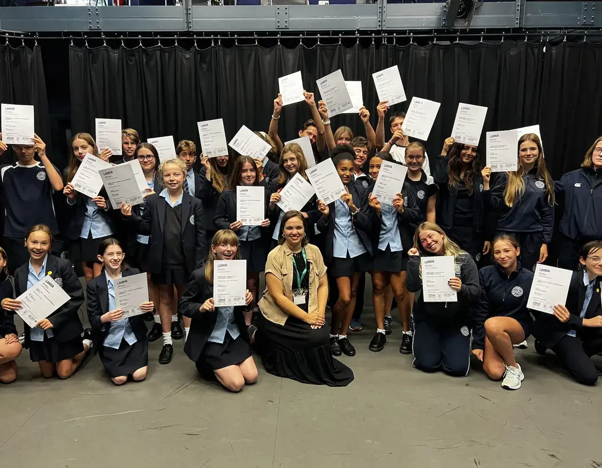 Senior pupils with their LAMDA resuts in their hands at Ibstock Place School, a private school near Richmond, Barnes, Putney, Kingston, and Wandsworth.