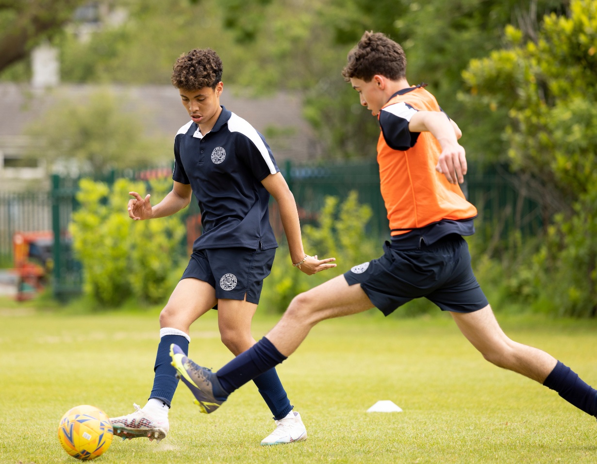 Senior pupils playing football at Ibstock Place School, a private school near Richmond, Barnes, Putney, Kingston, and Wandsworth.