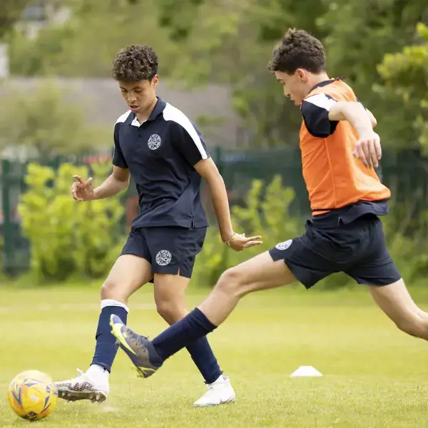 Sixth form pupils playing football at Ibstock Place School, a private school near Richmond, Barnes, Putney, Kingston, and Wandsworth.