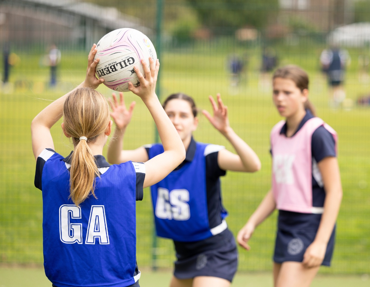 Senior pupils playing netball at Ibstock Place School, a private school near Richmond, Barnes, Putney, Kingston, and Wandsworth.