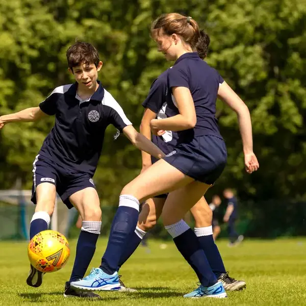 Sixth form pupils playing football at Ibstock Place School, a private school near Richmond, Barnes, Putney, Kingston, and Wandsworth.