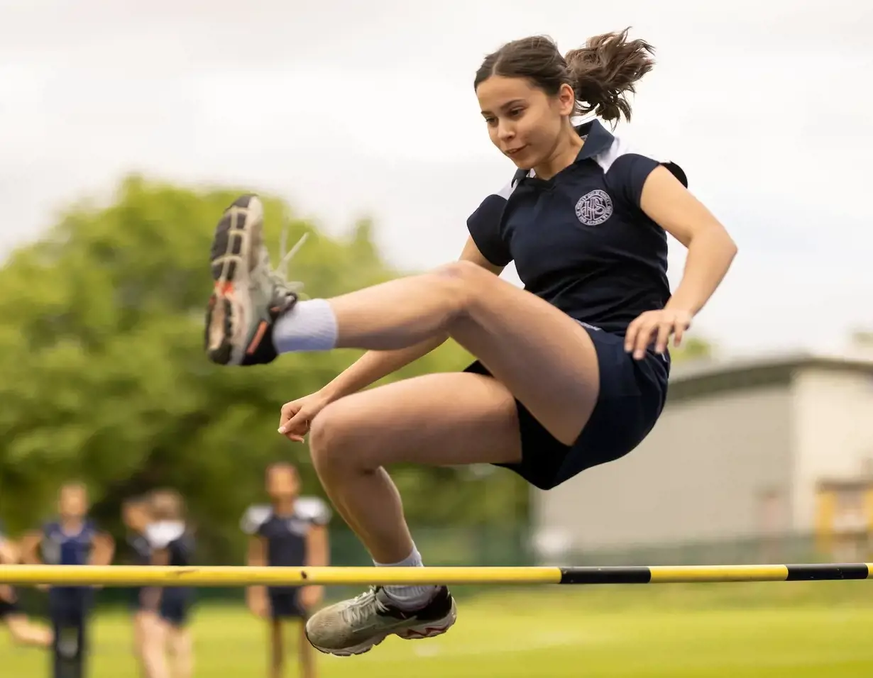 Senior pupils doing a hurdle race at Ibstock Place School, a private school near Richmond, Barnes, Putney, Kingston, and Wandsworth.