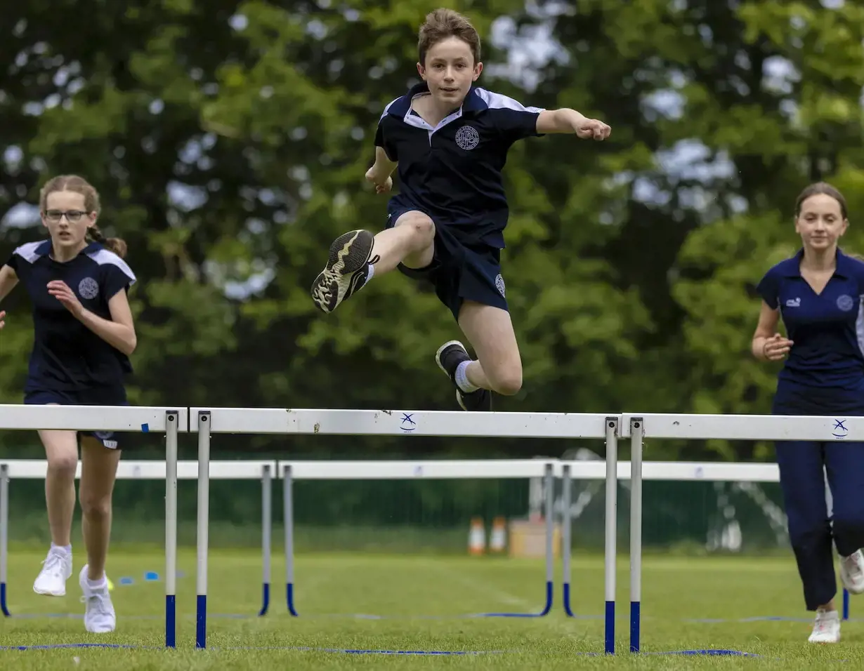Senior pupils doing the hurdle race at Ibstock Place School, a private school near Richmond.