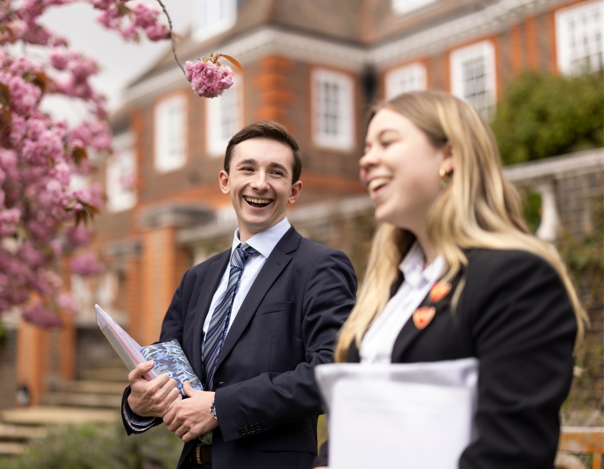 Sixth form pupils walking in the beautiful campus of Ibstock Place School, a private school near Richmond, Barnes, Putney, Kingston, and Wandsworth.