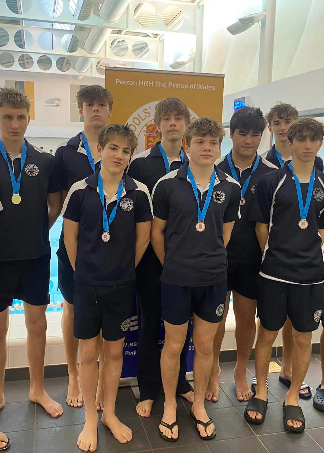 Senior pupils with gold medals for swimming at Ibstock Place School, a private school near Richmond, Barnes, Putney, Kingston, and Wandsworth.
