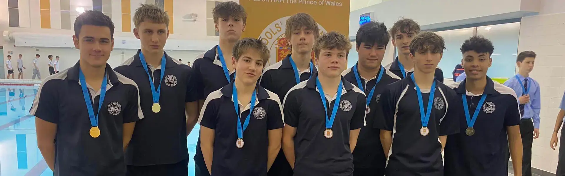 Senior pupils with gold medals for swimming at Ibstock Place School, a private school near Richmond, Barnes, Putney, Kingston, and Wandsworth.