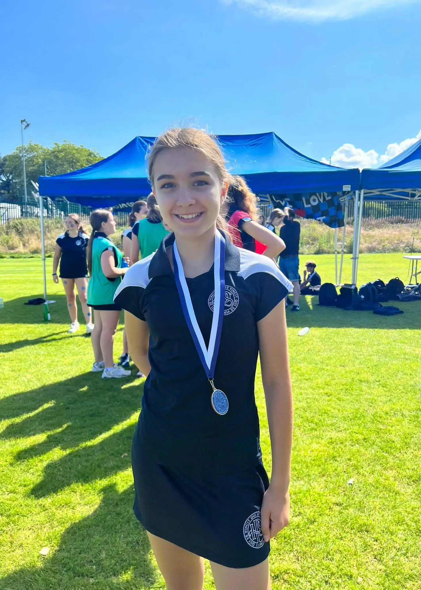 Track and Field Day, pupil with a medal| Ibstock Place School, Roehampton, Private School Near Richmond, Barnes, Putney, Kingston, & Wandsworth 