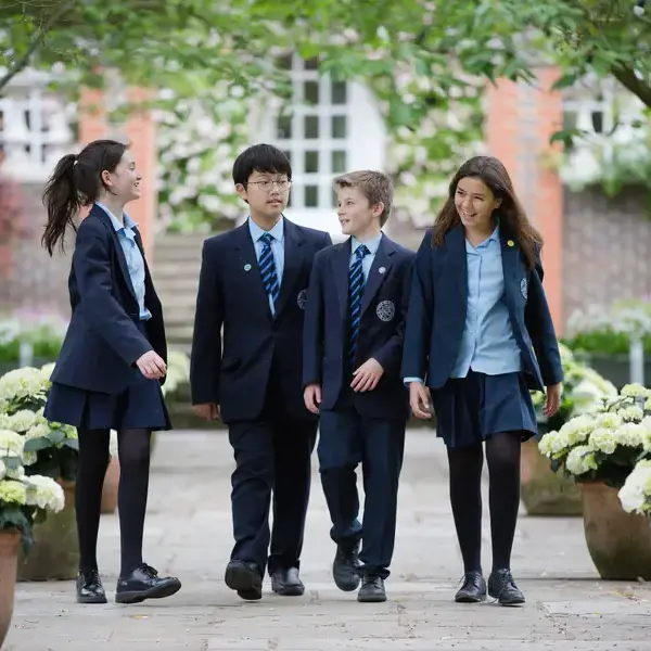 Senior pupils going to their class with books in their hands at Ibstock Place School, a private school near Richmond.