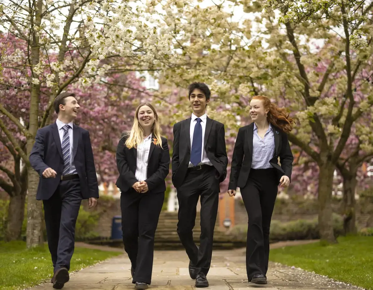 Sixth form pupils walking through the beautiful campus of  Ibstock Place School, a private school near Richmond.