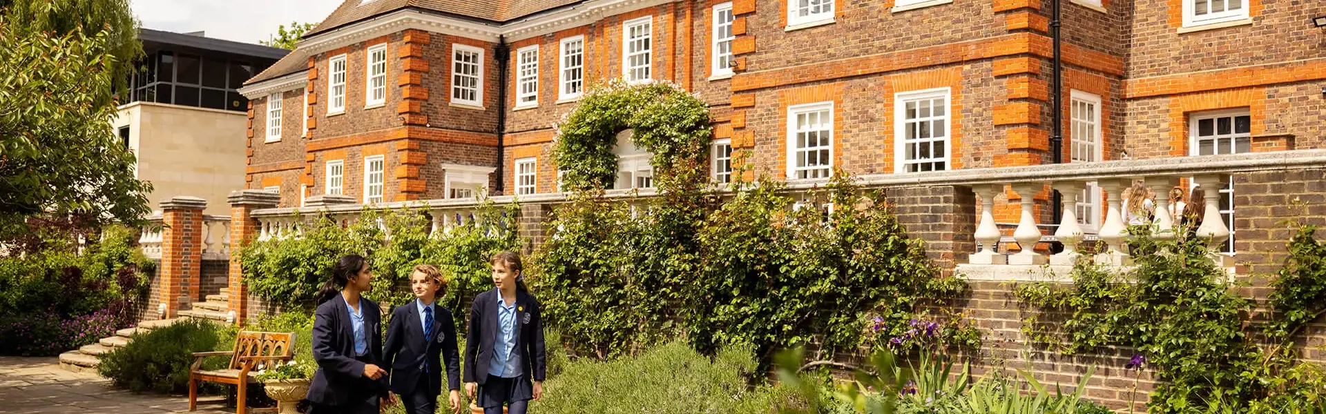 Ibstock Place School pupils walking in front of the school building