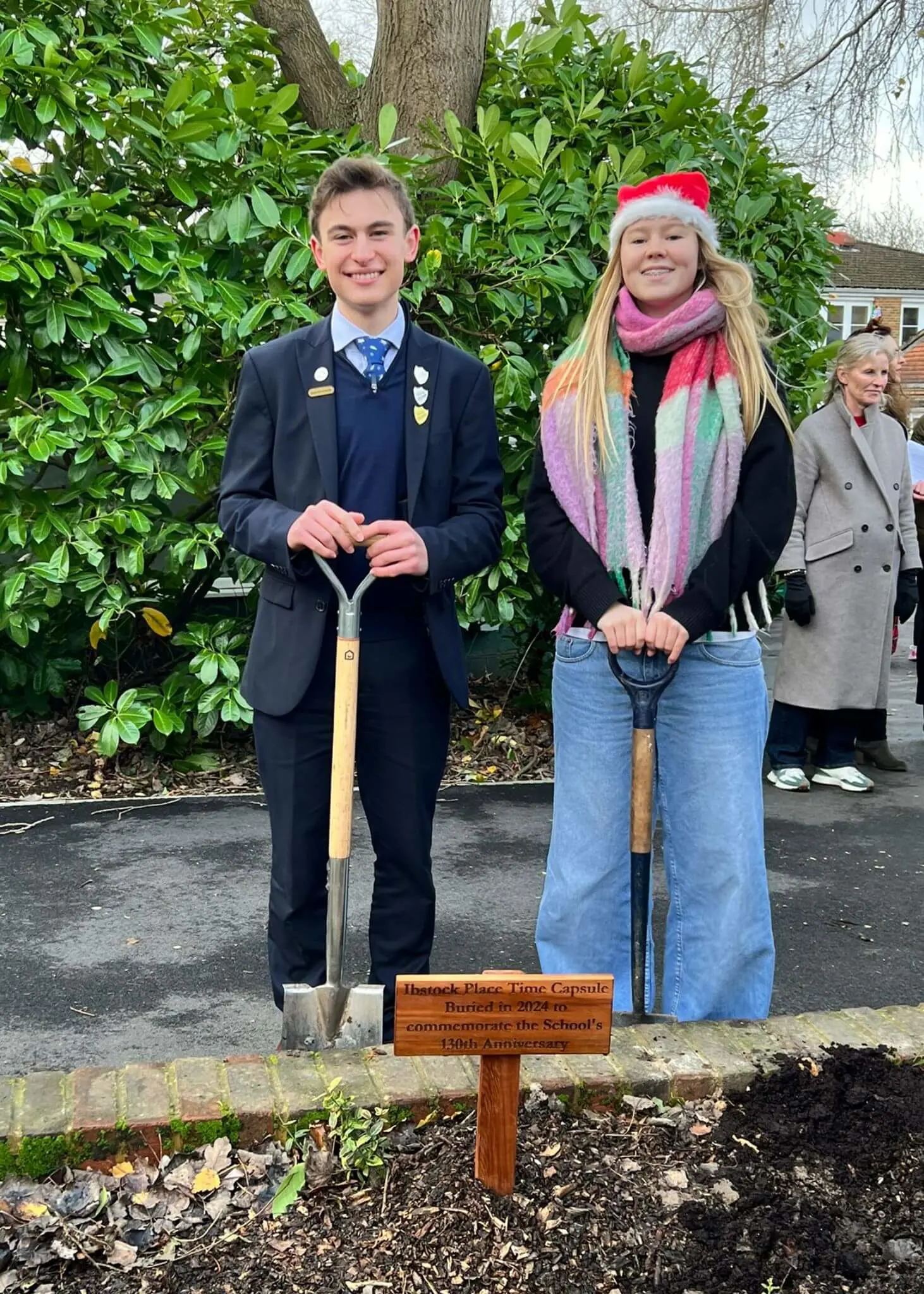 Senior pupils burying a time capsule | Ibstock Place School, Roehampton, Private School Near Richmond, Barnes, Putney, Kingston, & Wandsworth 