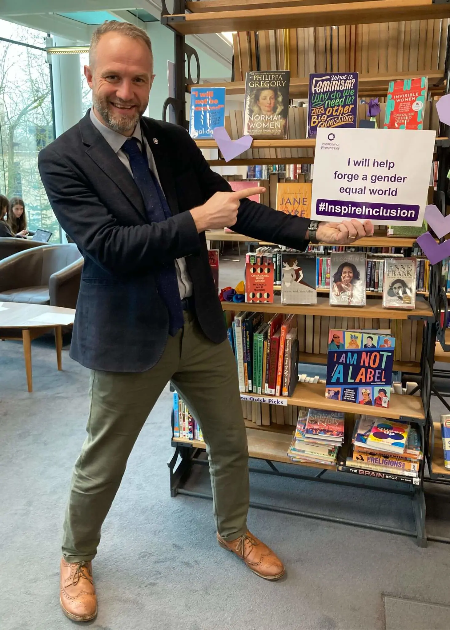 Staff Celebrating International Women's Day by wearing purple at Ibstock Place School, Roehampton, a private school near Richmond, Barnes, Putney, Kingston, & Wandsworth