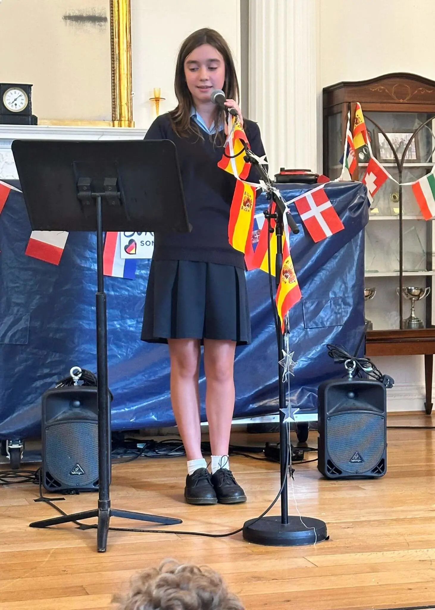 Senior pupils singing at Ibstock Place School, private school near Richmond, Barnes, Putney, Kingston, and Wandsworth on an overseas trip. 