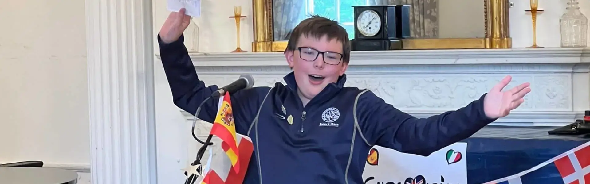 Senior pupil singing a French song, at a private school near Richmond, Barnes, Putney, Kingston, and Wandsworth on an overseas trip. 