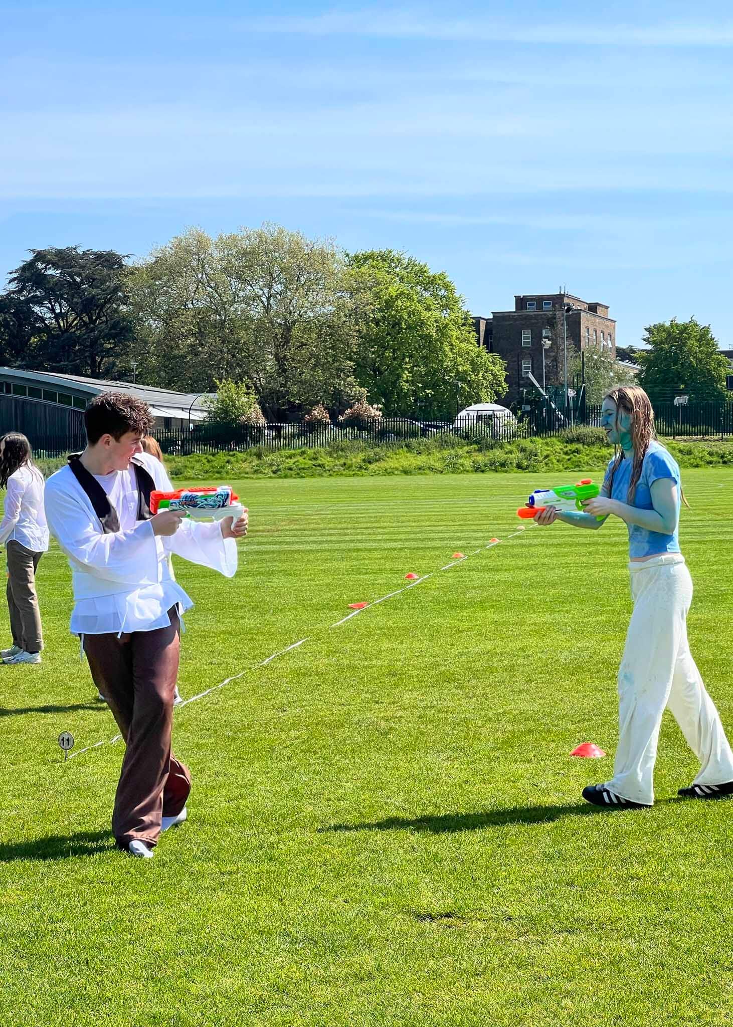 Upper sixth form having a water fight on the last day at  Ibstock Place School, a private school near Richmond, Barnes, Putney, Kingston, and Wandsworth on an overseas trip. 