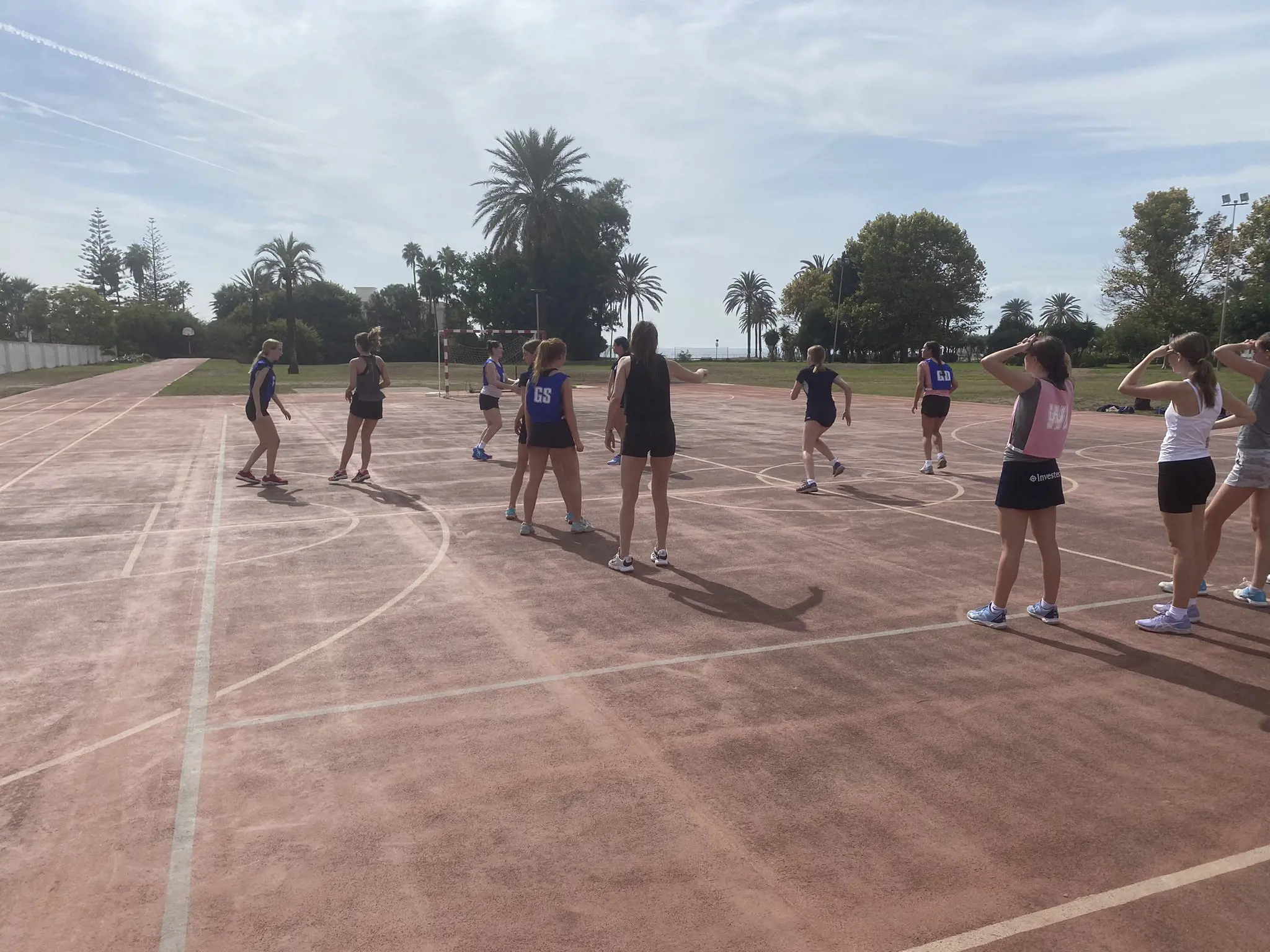 Sixth form girls playing volleyball at Ibstock Place School, a private school near Richmond, Barnes, Putney, Kingston, and Wandsworth